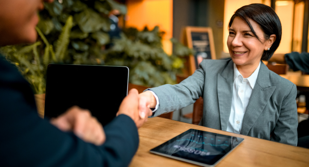 Behavioral health practice owner reviewing HIPAA compliant AI for therapists vendor agreement documentation at office desk